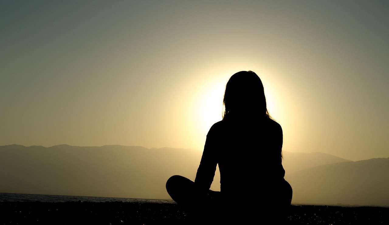 sitting silhouette at sunset